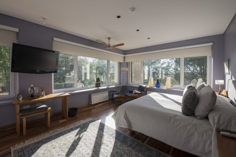 Corner bedroom with windows on two sides, Antucura Wine Estate