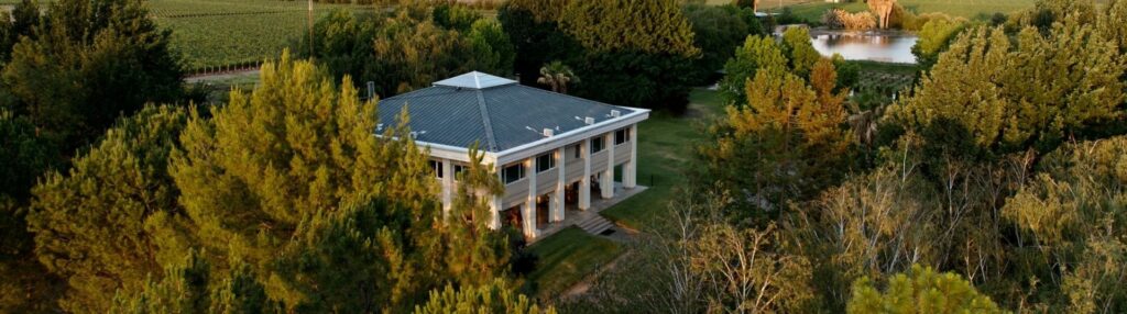 Aerial view of the house among the trees, Antucura Wine Estate