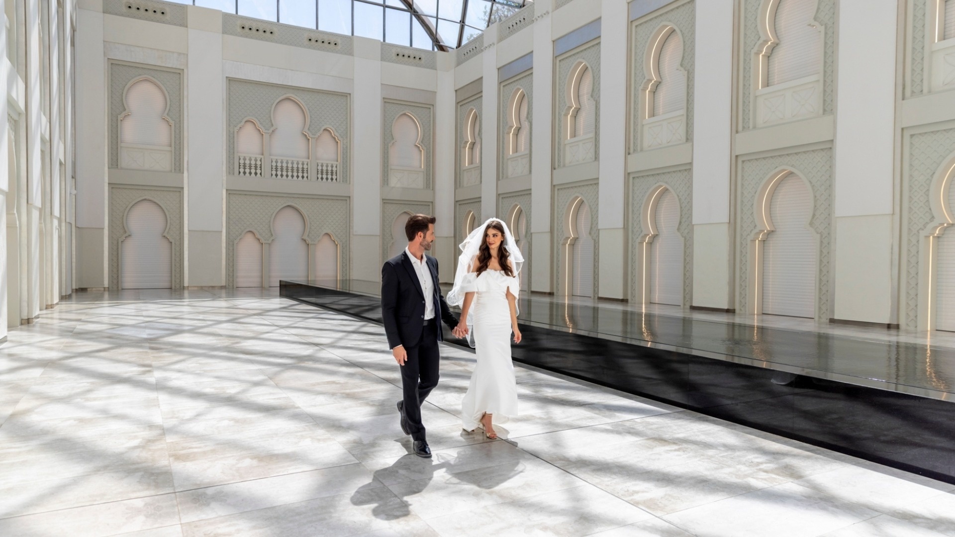 Skylight, with its tall white arched walls and glass roof, Arjaan by Rotana Dubai Media City