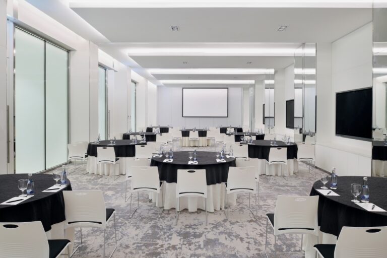 A meeting room set with tables and screens, Arjaan by Rotana Dubai Media City