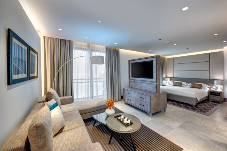 A suite living area and bedroom, Arjaan by Rotana Dubai Media City