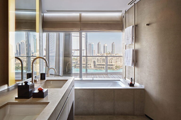 A suite bathroom with a view over the Dubai Fountain, Armani Hotel Dubai