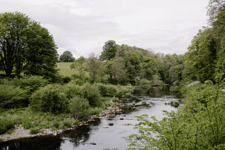 The River Lowther below Askham, lined with woodland, Askham Hall