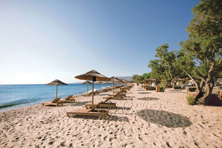 The beach with sunbeds and parasols, Atlantis Hotel