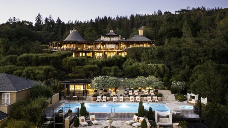 An aerial view of the resort and pool at dusk, Auberge du Soleil