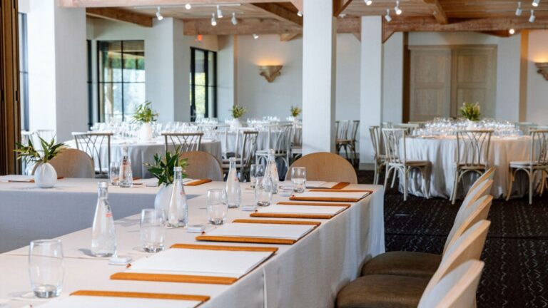 A bright reception table setting in the Bellevue Ballroom, Auberge du Soleil