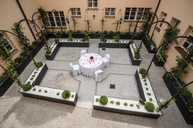 A courtyard laid for a celebration, Augustine Hotel, Prague