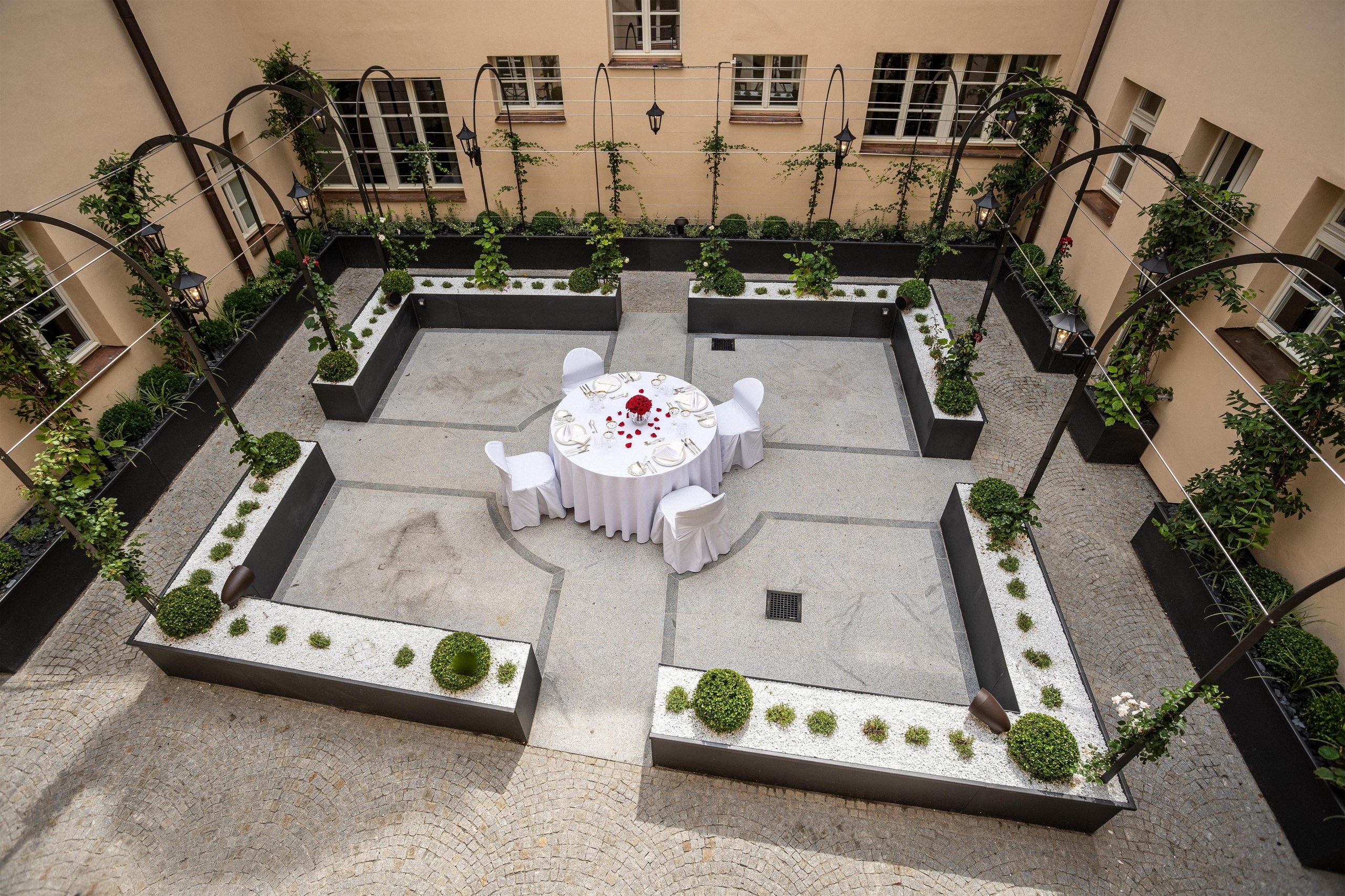 A courtyard laid for a celebration, Augustine Hotel, Prague