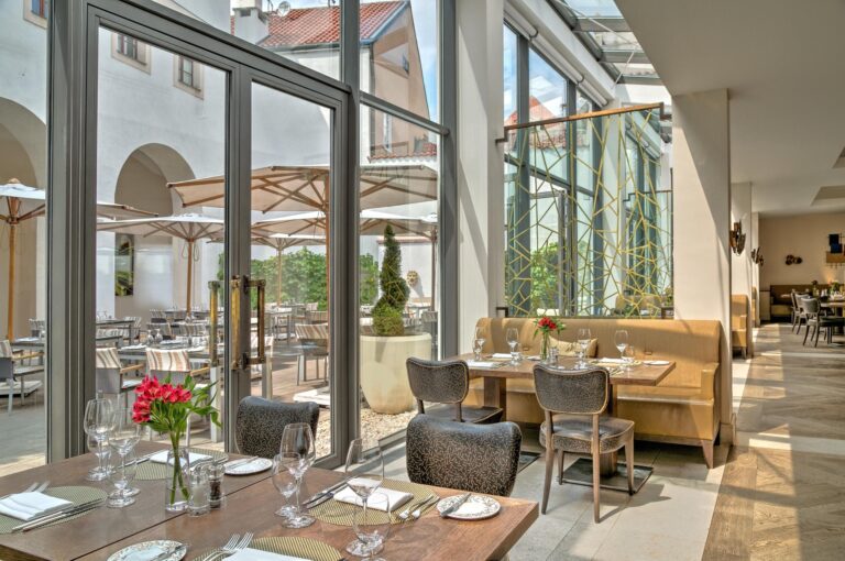 Restaurant dining room beside the courtyard, Augustine Hotel, Prague