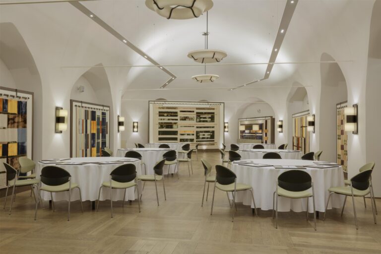 The hall set for a seated dinner, Augustine Hotel, Prague