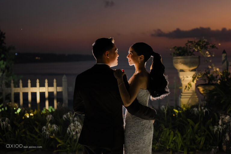 Couple dancing at dusk on a terrace above the sea, Jumeirah Bali, Axioo Bali