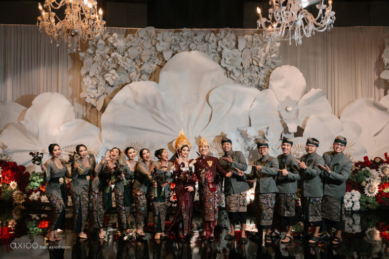 Wedding party on stage before a sculpted floral backdrop, Sanur, Bali, Axioo Bali