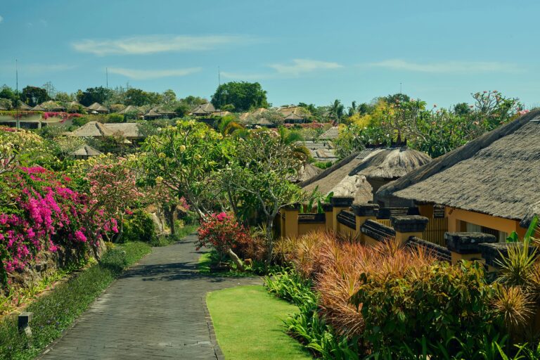 Thatched villas along a garden path, Ayana Estate Bali
