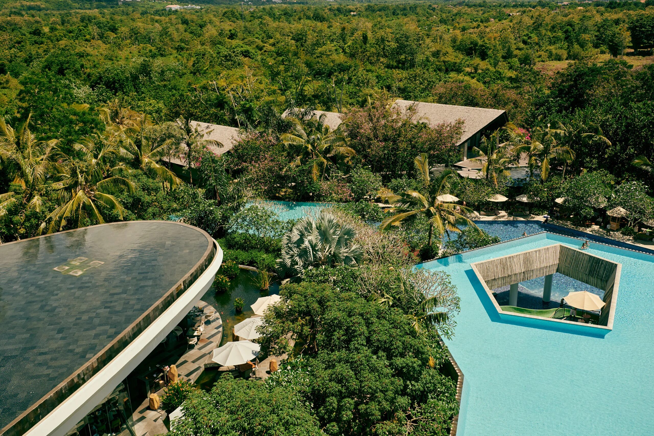 Aerial view of the RIMBA pools set in forest, Ayana Estate Bali