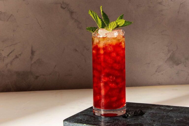 A red aperitivo cocktail on a marble bar top, Baglioni Resort Cala del Porto