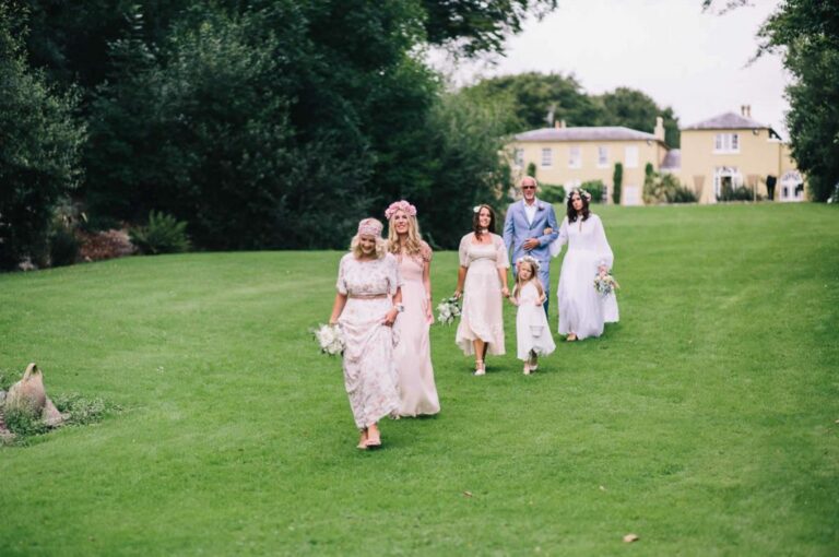 A wedding party walking across the lawn, Ballinacurra House