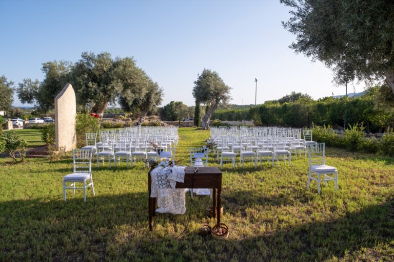Outdoor ceremony seating laid out on the lawn, Ballium Luxury Relais