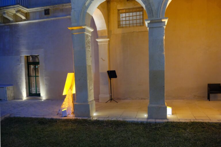 Arcaded portico lit in the evening, Ballium Luxury Relais