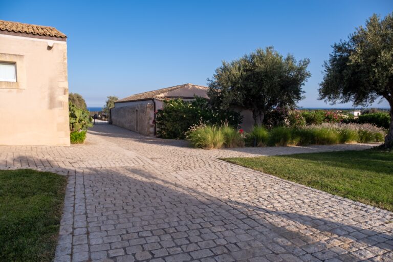 Paved path and olive garden beside the baglio, Ballium Luxury Relais
