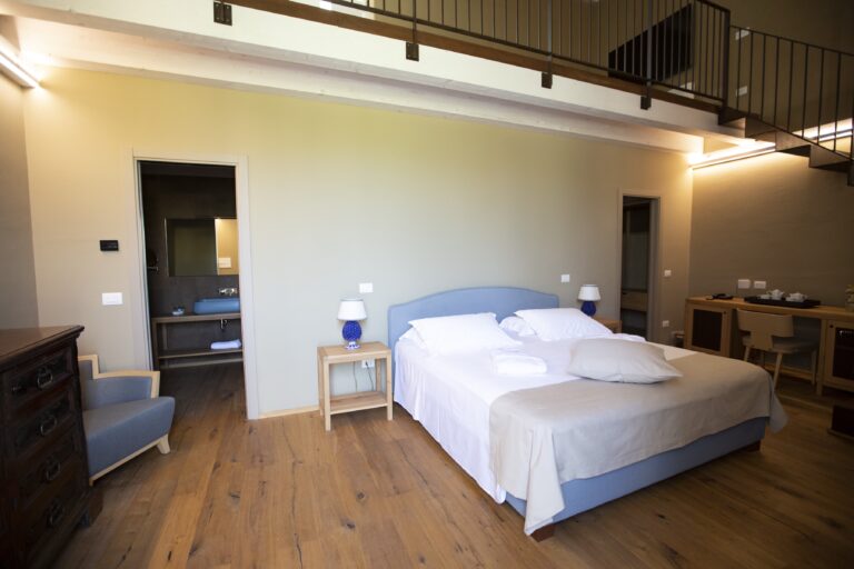 Suite bedroom with gallery above, Ballium Luxury Relais