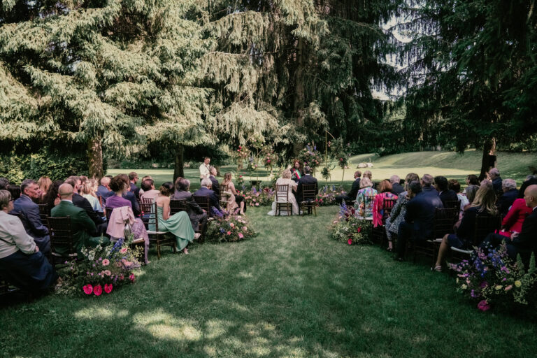 A ceremony on the lawn under the trees at Villa Semenza, Lecco, Barbara Zanon Photography