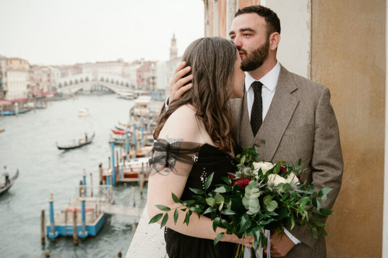An embrace above the Grand Canal, the Rialto Bridge in the distance, Venice, Barbara Zanon Photography
