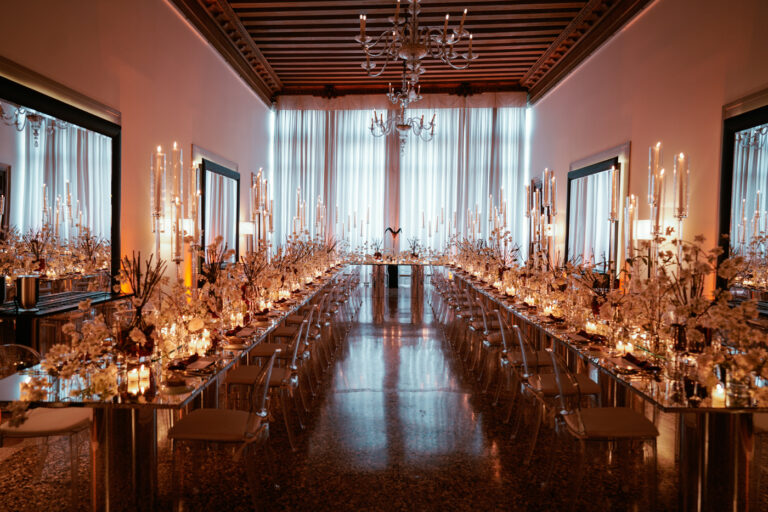 Long candlelit tables set for the reception at the Aman, Venice, Barbara Zanon Photography