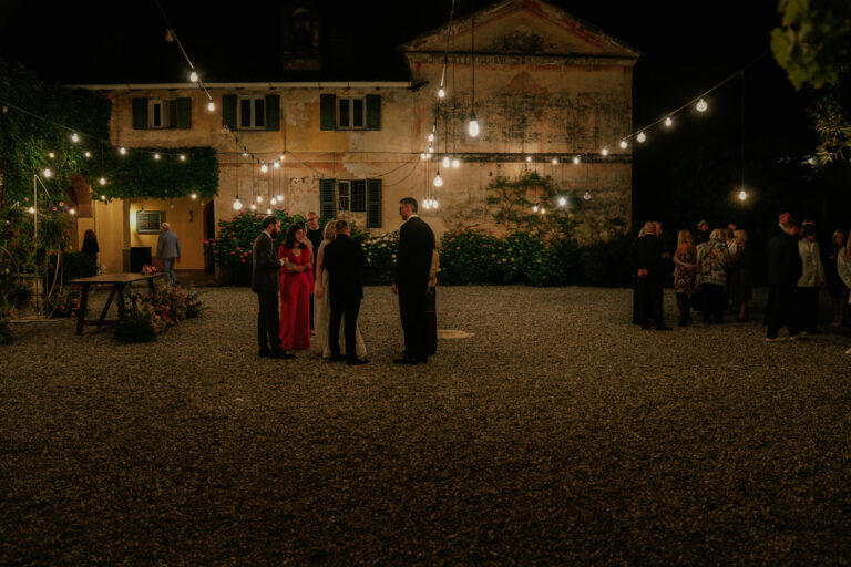 Villa Semenza at night, strung with lights, guests in the courtyard, Lecco, Barbara Zanon Photography