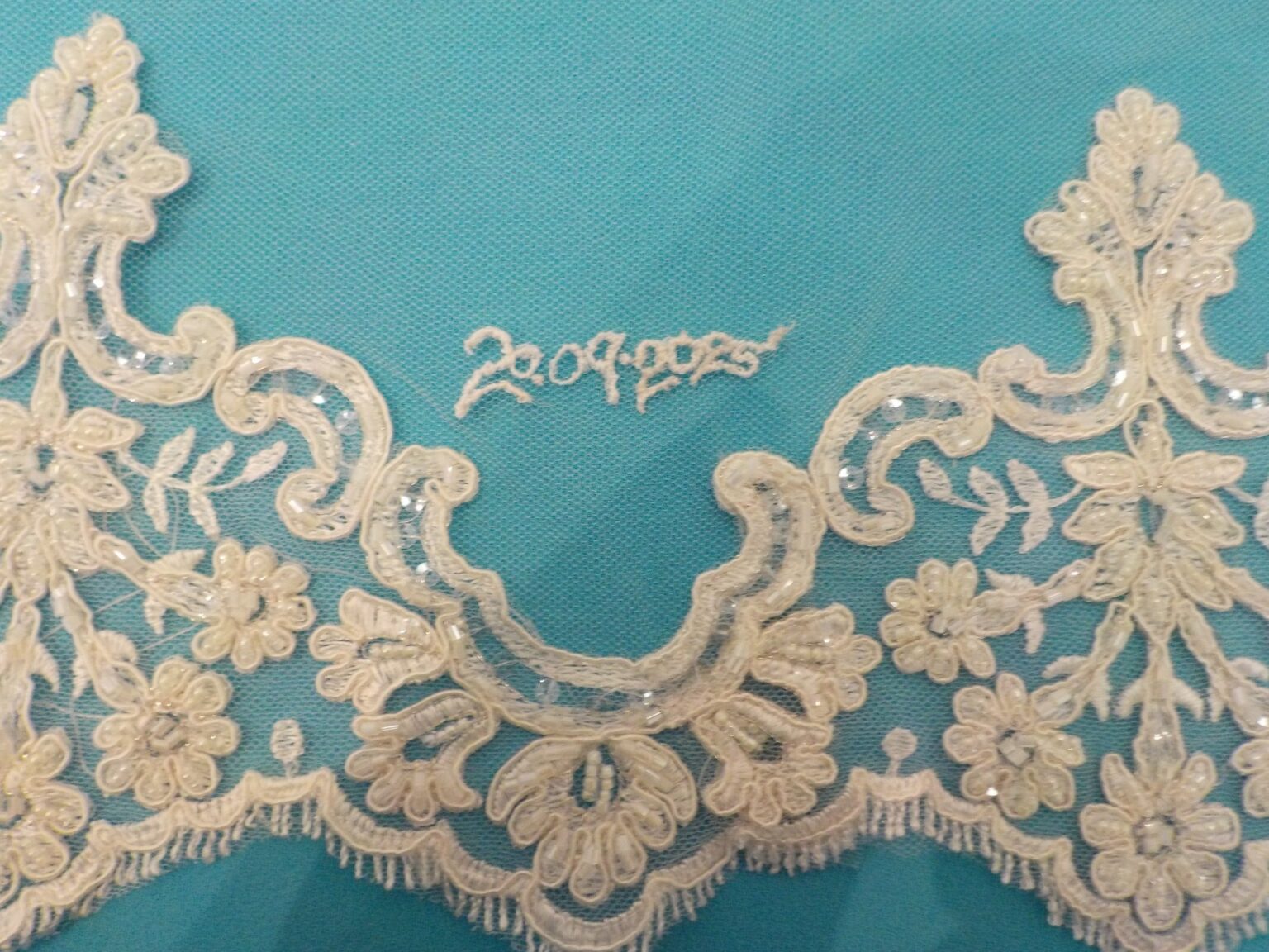 Lace veil edging with the wedding date hand embroidered in beads and sequins