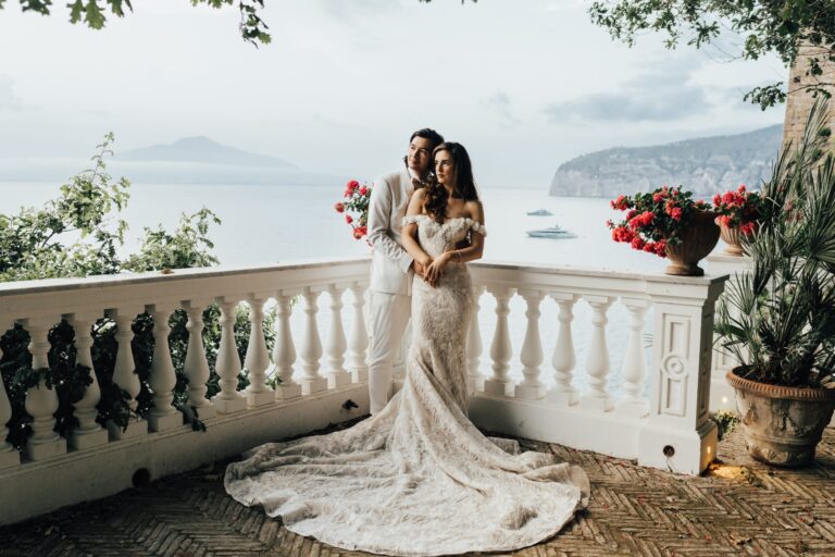 An embrace on a white balustraded terrace, Vesuvius across the Bay of Naples, Bella Sposa
