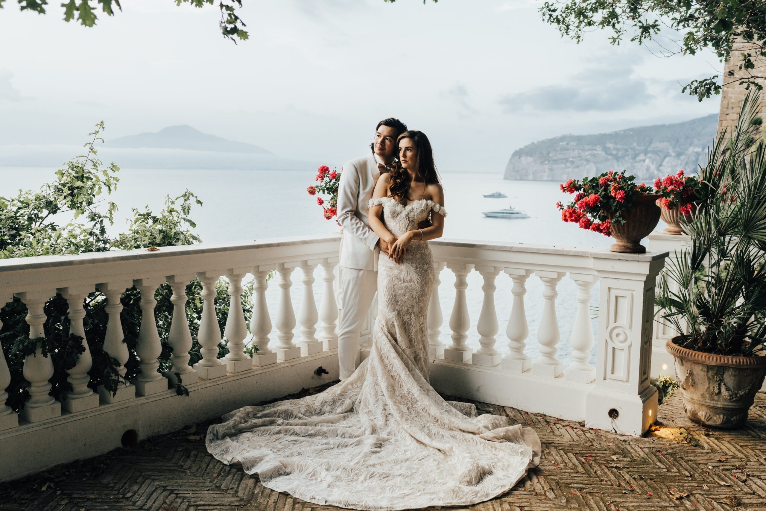 An embrace on a white balustraded terrace, Vesuvius across the Bay of Naples, Bella Sposa