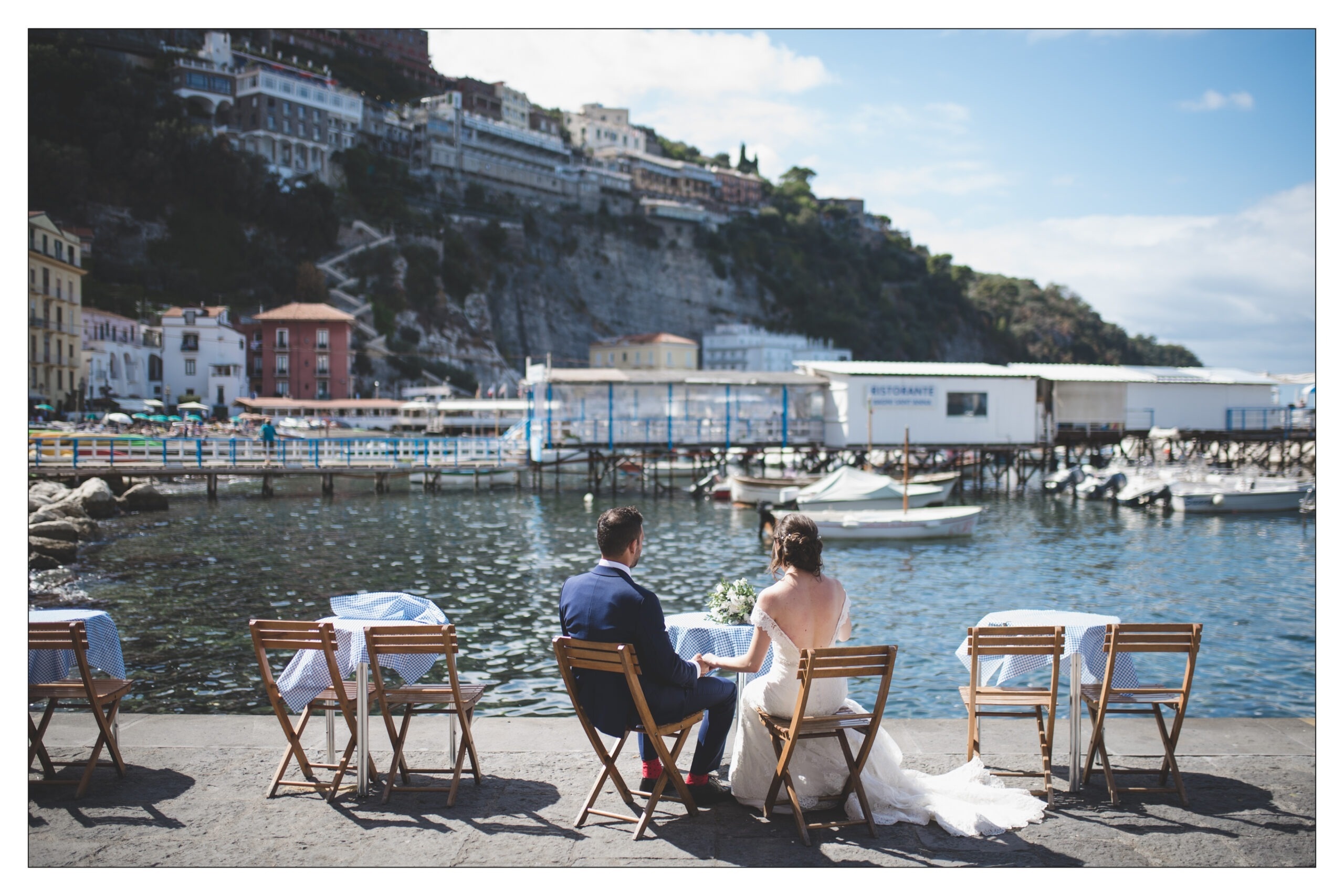 A bistro table at Marina Grande, Sorrento, the cliffside town banked above the harbour, Bella Sposa
