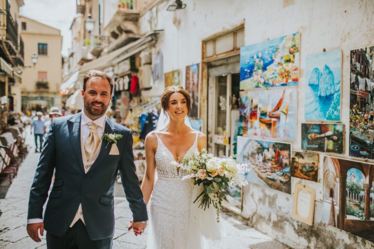 Walking Sorrento's old town, past a wall hung with paintings for sale, Bella Sposa