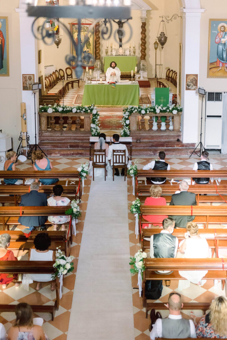 A floral-lined aisle at Saint Christopher Cathedral in Corfu Old Town, Belli Momenti