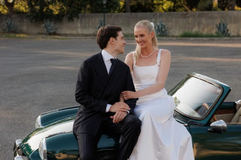 A couple on the bonnet of a vintage convertible in Corfu, Belli Momenti