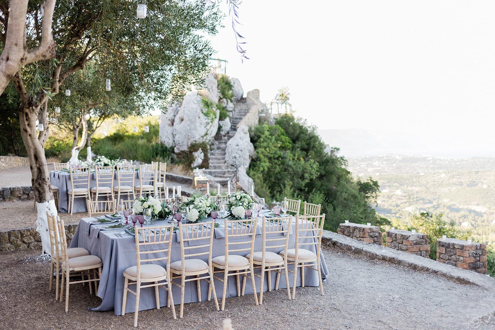 A long reception table above the Ionian landscape at Kaizer's Throne, Corfu, Belli Momenti