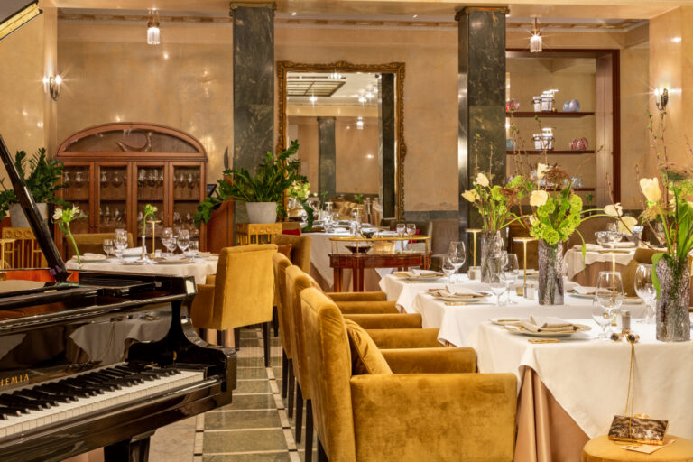 A restaurant dining room with a grand piano, Belmond Grand Hotel Europe