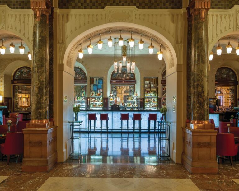 The bar seen through a marble archway, Belmond Grand Hotel Europe