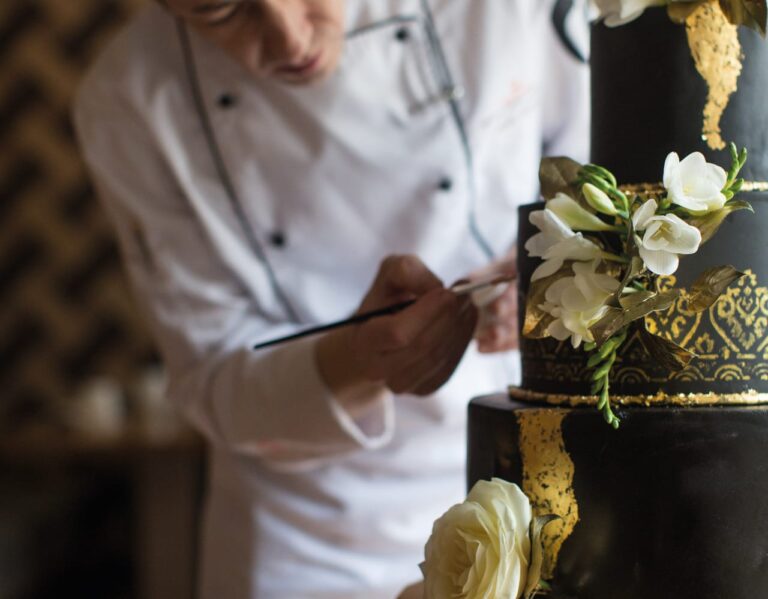 The pastry chef decorating a cake, Belmond Grand Hotel Europe