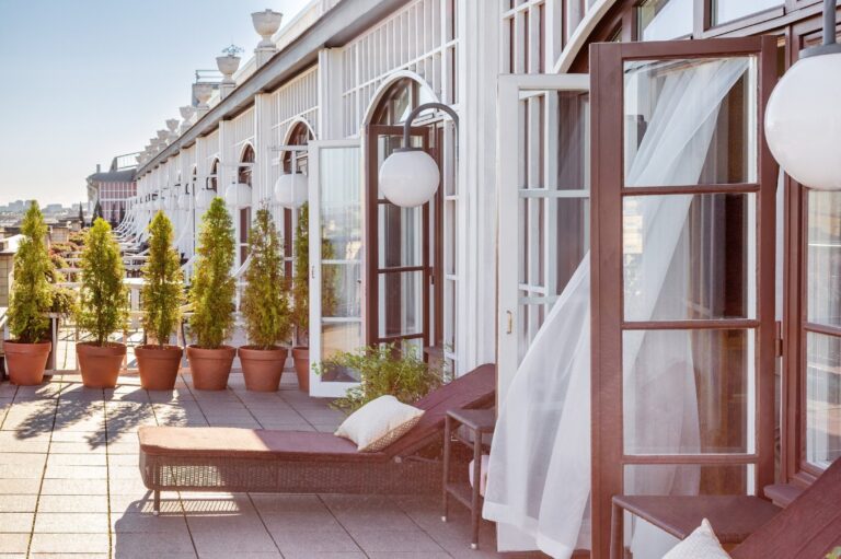 A fifth-floor terrace with views over the rooftops, Belmond Grand Hotel Europe
