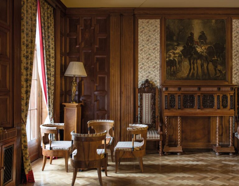The Lidval Room with dark wood panelling, Belmond Grand Hotel Europe