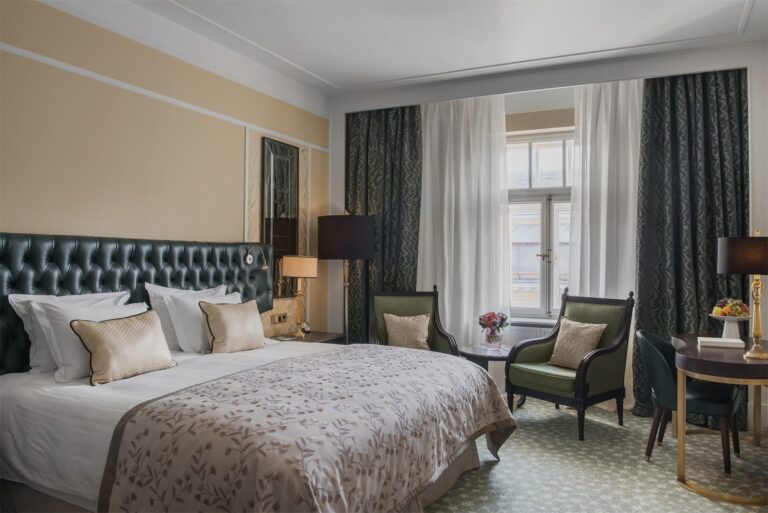 A Deluxe Room with a tufted headboard, Belmond Grand Hotel Europe