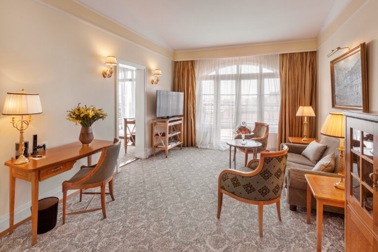 A suite sitting room with a writing desk, Belmond Grand Hotel Europe