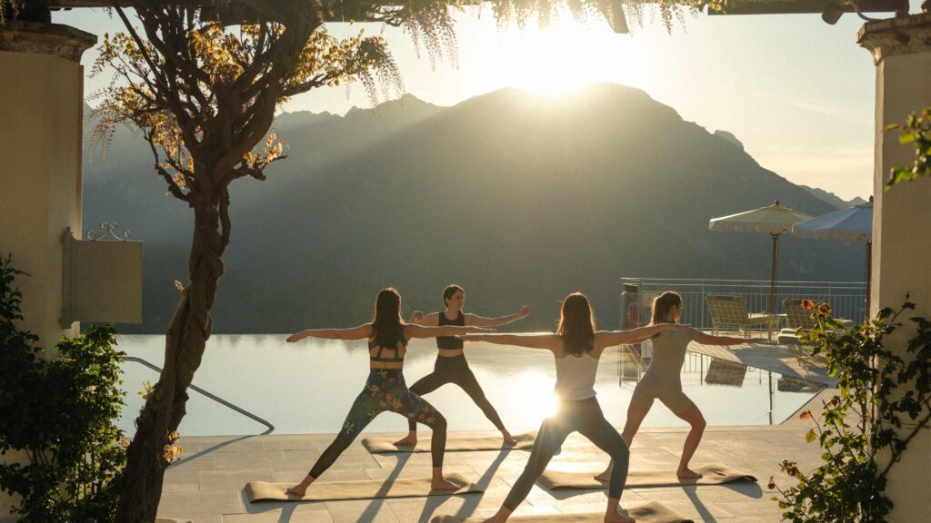 Yoga session at the pool terrace at sunrise, Belmond Hotel Caruso
