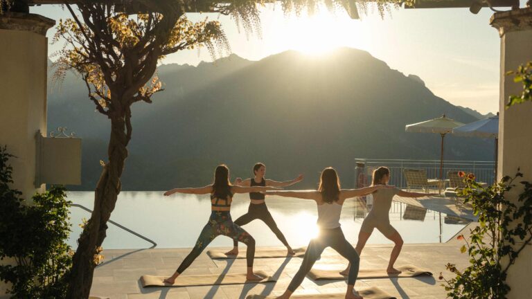 Yoga session at the pool terrace at sunrise, Belmond Hotel Caruso