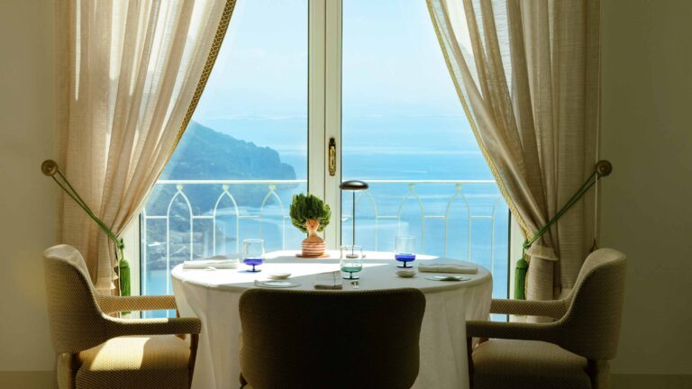 Il Pantaleone dining room table by the sea window, Belmond Hotel Caruso