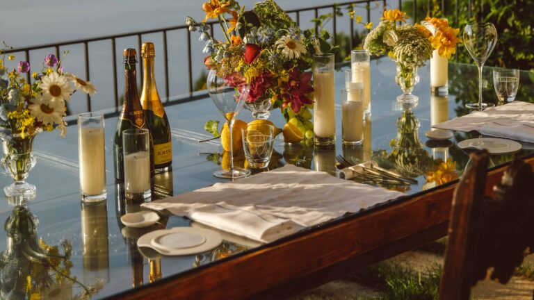 Table set with flowers and candles on the terrace, Belmond Hotel Caruso