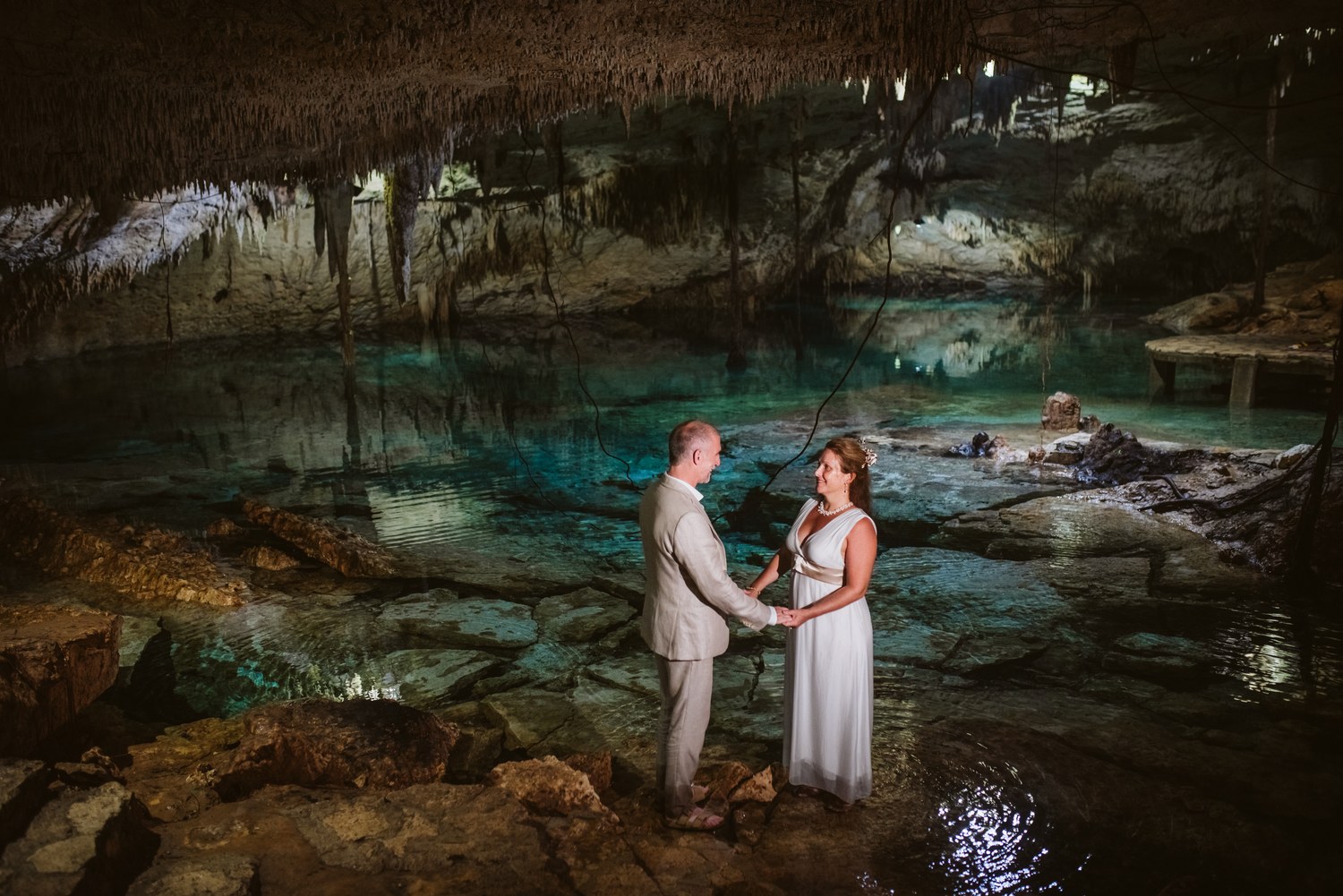 A couple exchanging vows on the edge of a cenote pool, Better Together Mexico