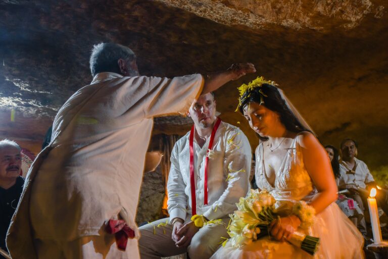 A Mayan blessing for a couple in a cenote cave, with flowers and wreath, Better Together Mexico