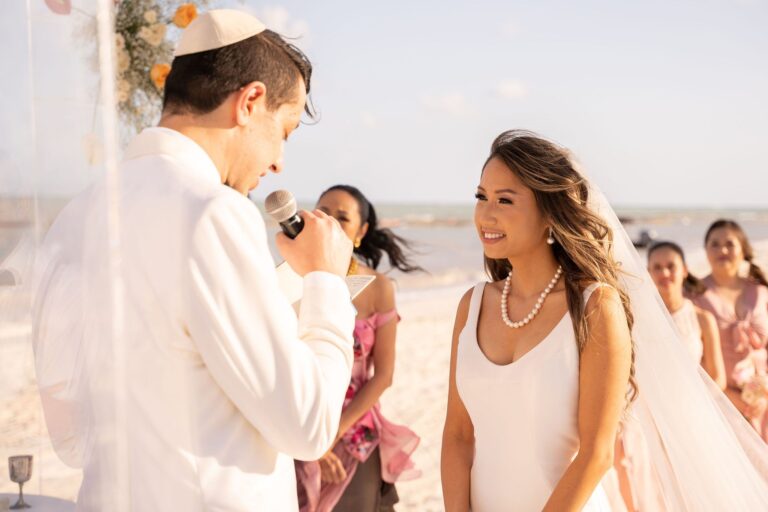 Jewish beach ceremony with the groom in a kippah and the bride beside the officiant, Better Together Mexico